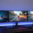 Best Gaming Monitors Under 400 USD – three gaming monitors in a desk setup showing different panel technologies