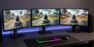 Best Monitors for Warzone gaming setup with three displays showing competitive gameplay