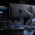 AOC monitor arm supporting a screen at a tidy London home-office desk